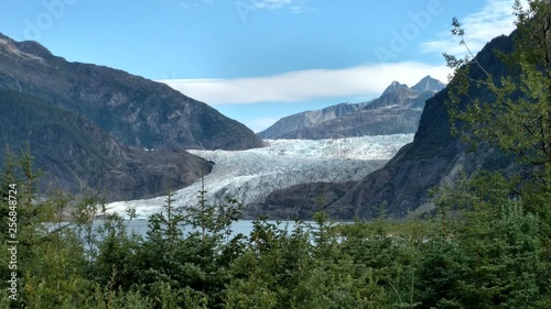 Fototapeta Naklejka Na Ścianę i Meble -  Mendenhall Glacier Juneau Alaska. Mendenhall Glacier flowing into Mendenhall Lake in between mountains with Nugget falls. Perfect tourist location