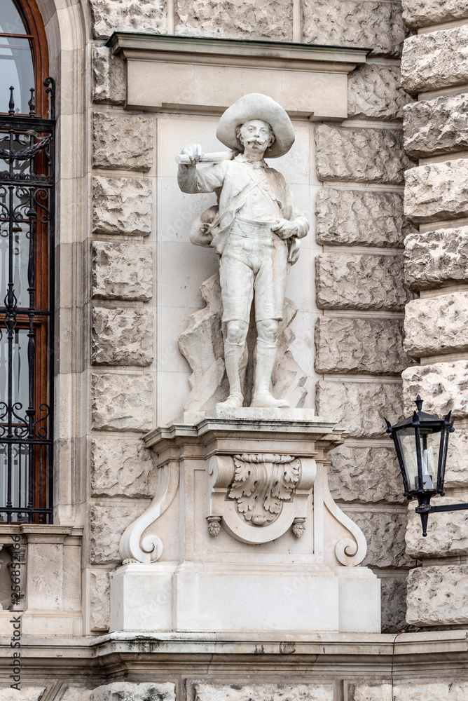 Austria, Vienna, Heldenplatz: Big statue sculpture at the Neue Burg exterior wall facade as part of the famous Hofburg Palace in the city center of the Austrian capital - concept architecture art