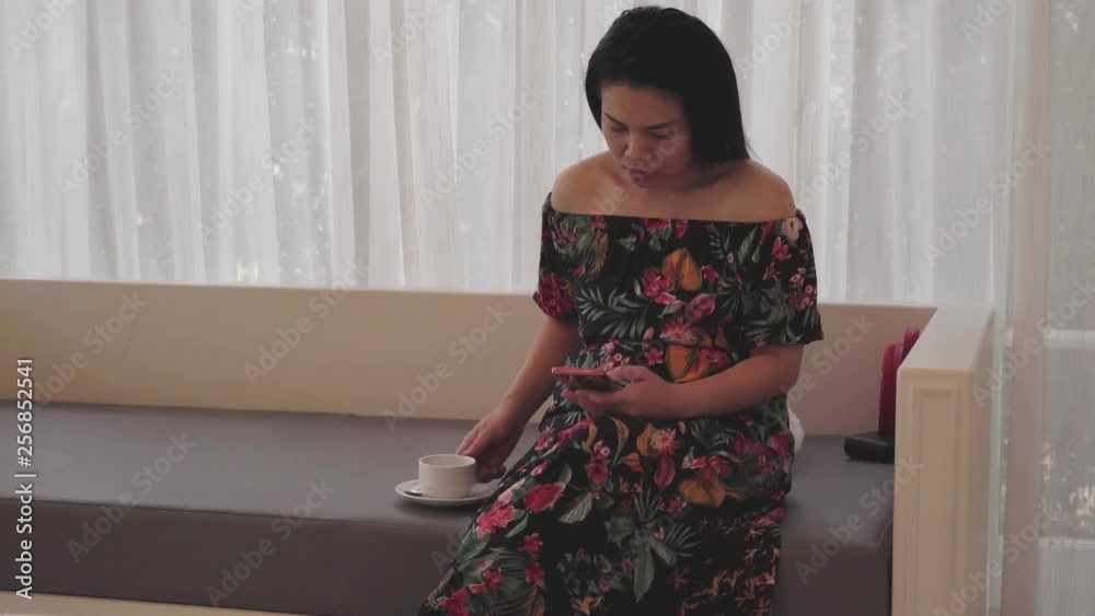 Asian woman using smart phone for social network Asian woman using smart phone for social network