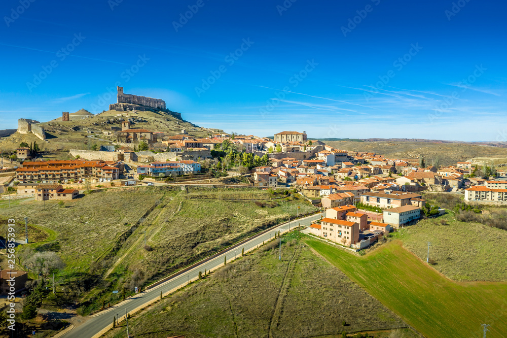 Atienza aerial panorama with blue sky of medieval ruined castle and town with city walls in Castille and Leon Spain