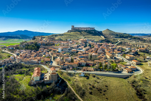 Atienza aerial panorama with blue sky of medieval ruined castle and town with city walls in Castille and Leon Spain photo