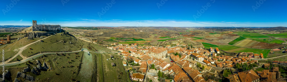 Atienza aerial panorama with blue sky of medieval ruined castle and town with city walls in Castille and Leon Spain