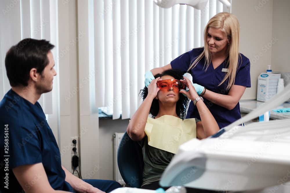 Dentist and his assitant working in private practice