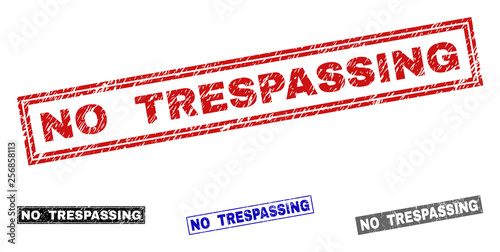 Grunge NO TRESPASSING rectangle stamp seals isolated on a white background. Rectangular seals with grunge texture in red, blue, black and grey colors.