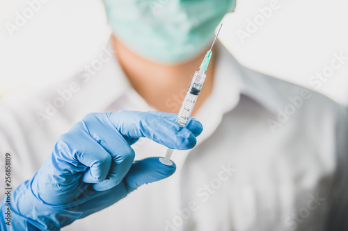 Bild auf Leinwand Doctor, nurse, scientist, man or women holding flu, hpv, rabies, mumps, measles,