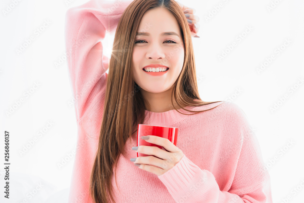 beautiful attractive asian woman pink sweater with hot drink on white bed morning freshness healthy lifestyle beautiful attractive asian woman pink sweater with hot drink on white bed morning freshness healthy lifestyle