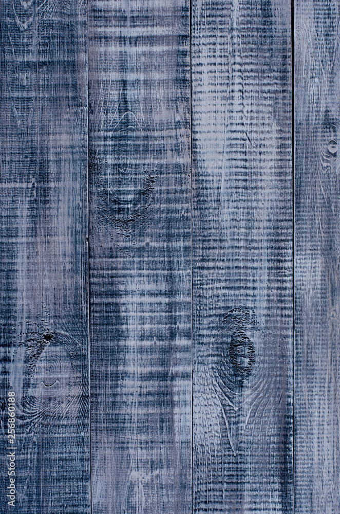 Dark blue wooden background made of a wide board. Dark blue wooden background made of a wide board.