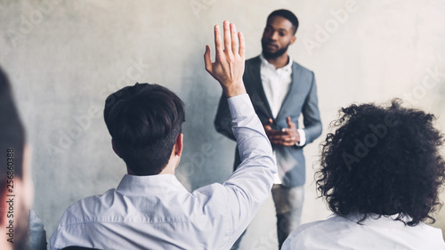 фотографія Businessman raising his hand, having question, crop