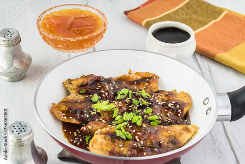 Roasted chickin breast with apricot jam soy sauce. photo