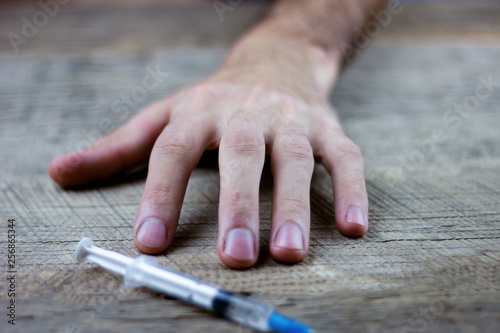 drug addict holding a syringe