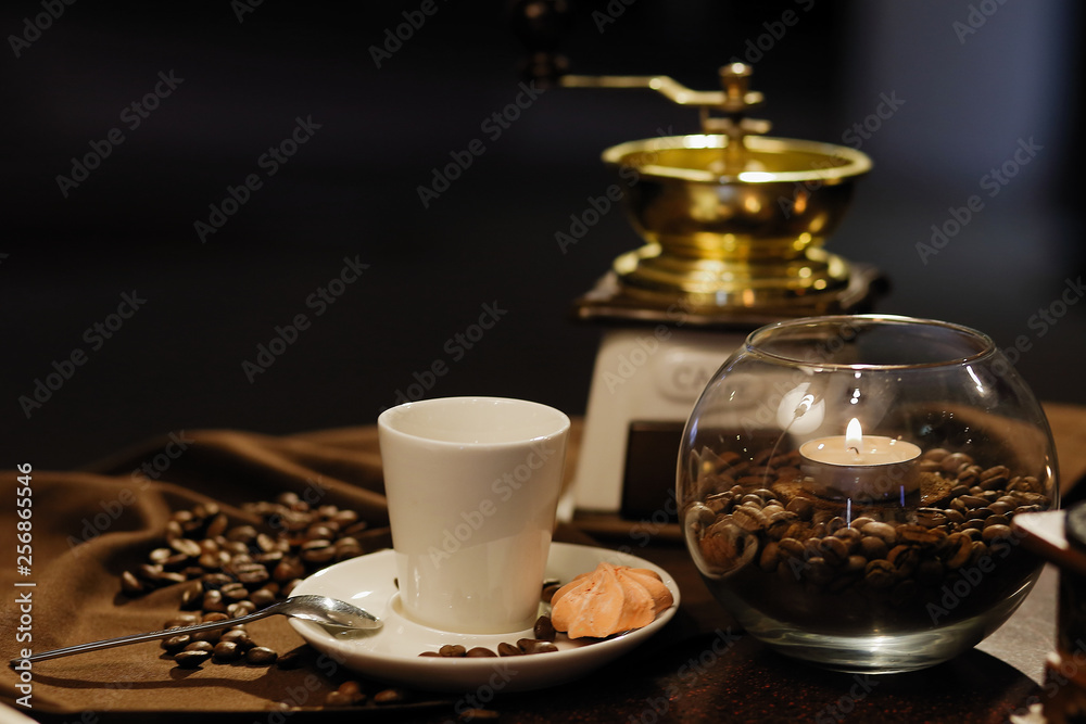 cup of coffee with beans and grinder cup of coffee with beans and grinder
