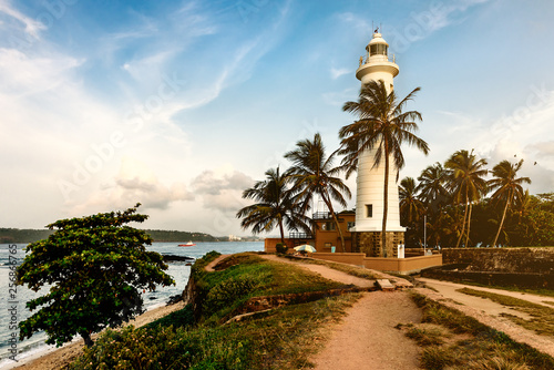 white lighthouse on the seashore