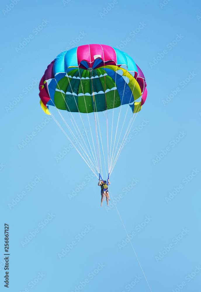 Fly a parachute over the sea, paraglider flying over the sea Fly a parachute over the sea, paraglider flying over the sea
