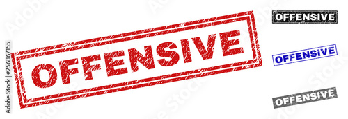 Grunge OFFENSIVE rectangle stamps isolated on a white background. Rectangular seals with grunge texture in red, blue, black and grey colors.