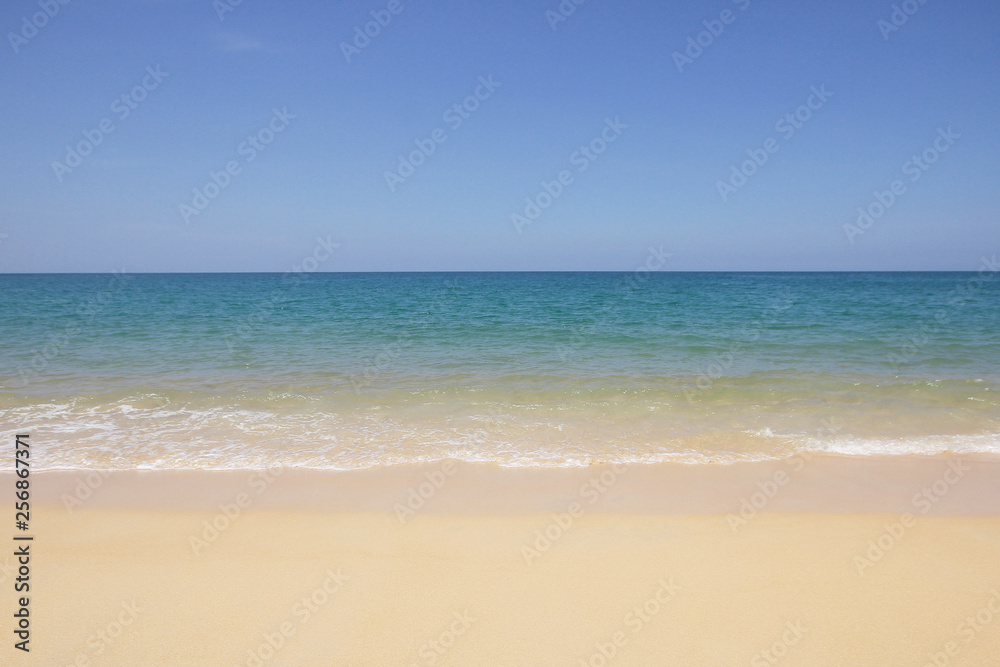 Idyllic crystal beach and seawater in front of luxury hotel, attractive clear sea, nature coastline backgrounds during holidays sunbathing, wave from clear blue green sea and fine sand Idyllic crystal beach and seawater in front of luxury hotel, attractive clear sea, nature coastline backgrounds during holidays sunbathing, wave from clear blue green sea and fine sand