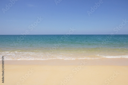 Idyllic crystal beach and seawater in front of luxury hotel, attractive clear sea, nature coastline backgrounds during holidays sunbathing, wave from clear blue green sea and fine sand © biggereye