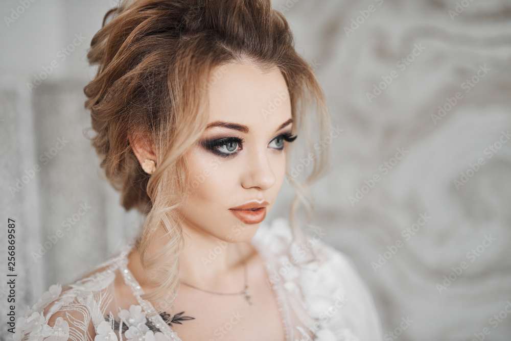Fototapeta premium Sexy lady in elegant panties and stockings. Fashion portrait of bride indoors.