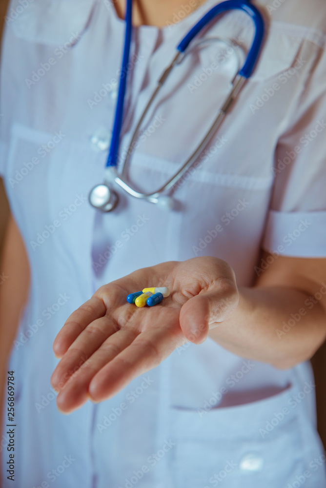 hands of doctor with pills closeup hands of doctor with pills closeup