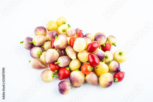 Bunch of fresh colorful peppers on white background