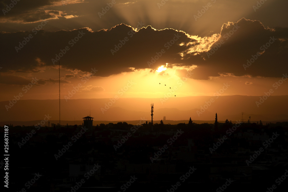 A sunset in Cordoba, Argentina, with the mountains in the background, seen from Güemes district A sunset in Cordoba, Argentina, with the mountains in the background, seen from Güemes district