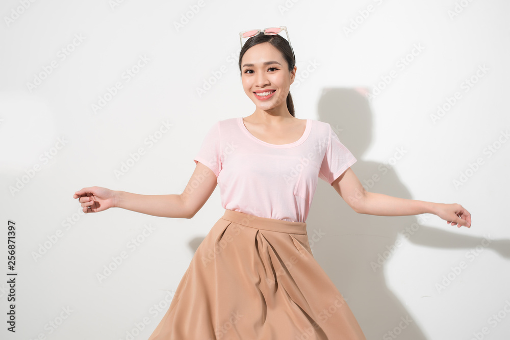 Magnificent girl dancing with smile in white studio. Indoor portrait of inspired caucasian lady in romantic outfit expressing happy emotions. Magnificent girl dancing with smile in white studio. Indoor portrait of inspired caucasian lady in romantic outfit expressing happy emotions.