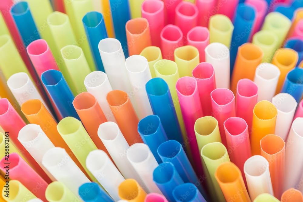 close up of colorful and bright plastic straws with copy space close up of colorful and bright plastic straws with copy space
