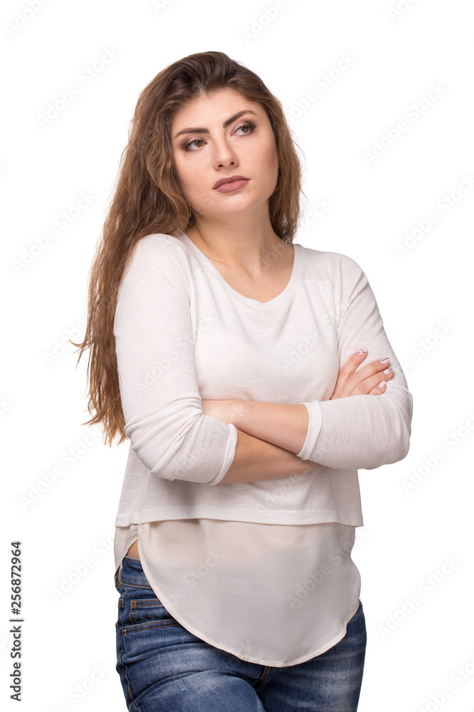 Young mistrustful attractive long haired woman with crossed arms Young mistrustful attractive long haired woman with crossed arms