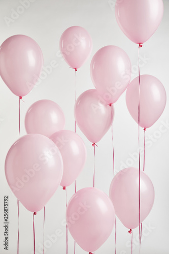 Foto background with decorative pink air balloons isolated on white