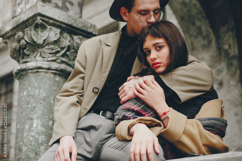 A trendy couple in a gloomy city A trendy couple in a gloomy city