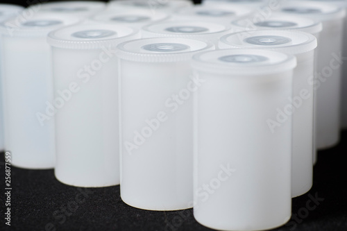 Plastic Film Canisters on dark background for 35mm film photography