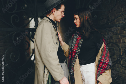 A trendy couple in a gloomy city © hetmanstock2