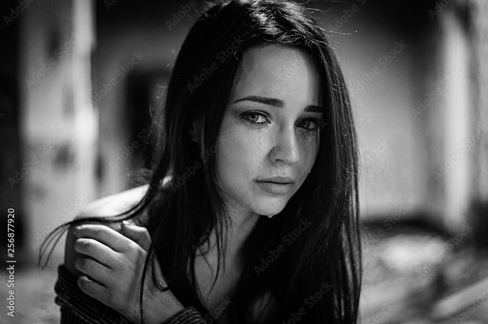 The girl suffers and cries. Portrait. Black and white The girl suffers and cries. Portrait. Black and white