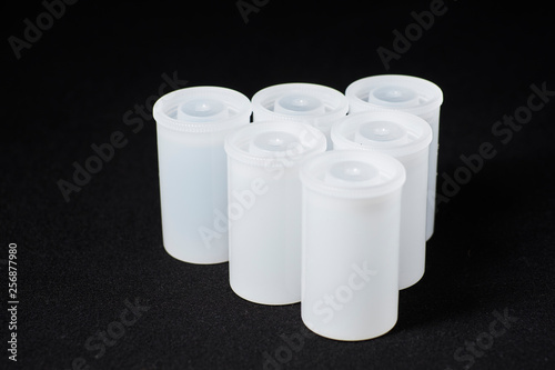 Plastic Film Canisters on dark background for 35mm film photography