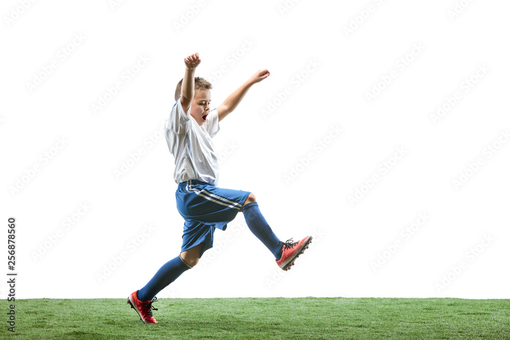 Young boy running and jumping isolated on white studio background. Junior football soccer player in motion Young boy running and jumping isolated on white studio background. Junior football soccer player in motion