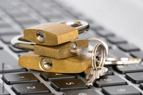 Wallpaper Mural Three padlocks on the keyboard Torontodigital.ca