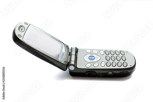 Bild auf Leinwand Black folding push-button old mobile phone on a white background