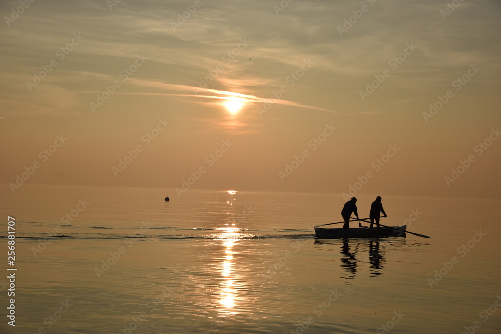 Boat Men In The Sunset