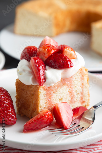 Fényképezés Angel food cake with whipped cream and strawberries