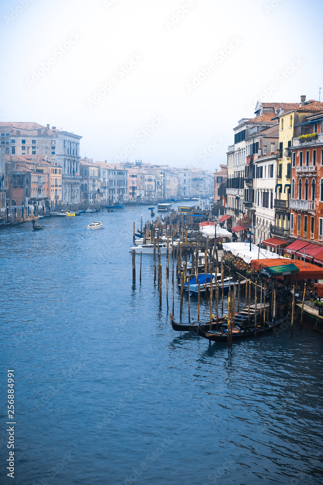 Venice / Italy 19 february 2019 :view of the Canal in Venice from Rialto bridge,gondolas are crossing the river and people enjoy their winter vacations