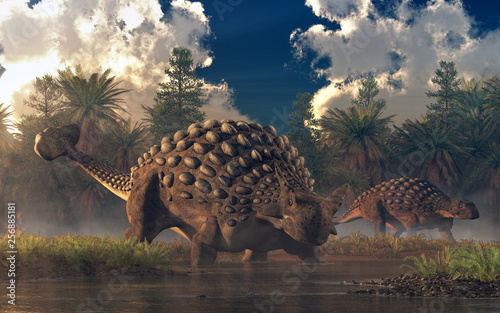 Fototapeta Naklejka Na Ścianę i Meble -  A pair of ankylosaurs graze in a watery lowland.  One of the two faces the viewer.  These cretaceous era armored dinosaurs are one of the best known of the prehistoric reptiles. 3D Rendering