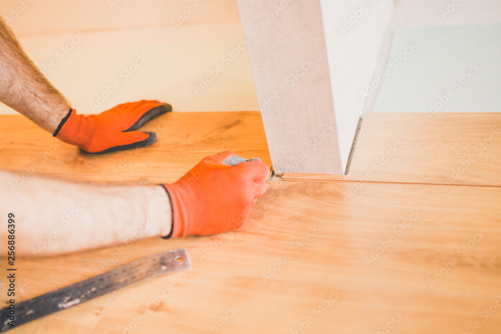 Finishing work at home - laying a new laminate flooring Finishing work at home - laying a new laminate flooring