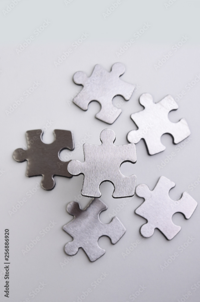 metal puzzle on a white background metal puzzle on a white background