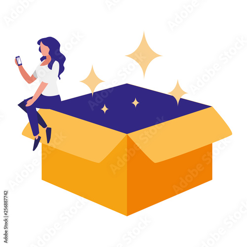 woman using smartphone with carton box