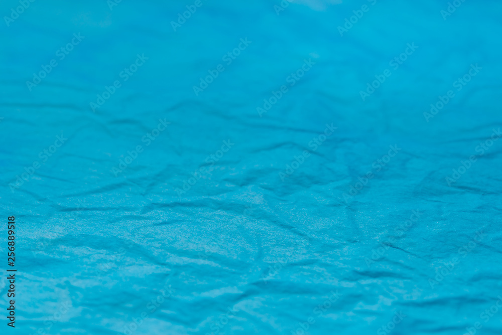 Obraz premium blue creased tissue papet background texture selective focus macro