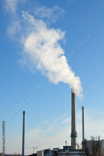 industrial area with smoking chimney