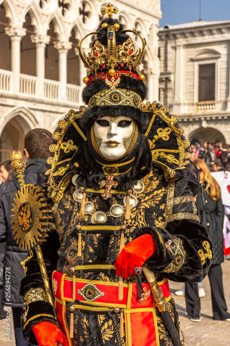 Italy, Venice, carnival 2019, typical masks, beautiful clothes, posing for photographers and tourists in Piazza San Marco. © benny