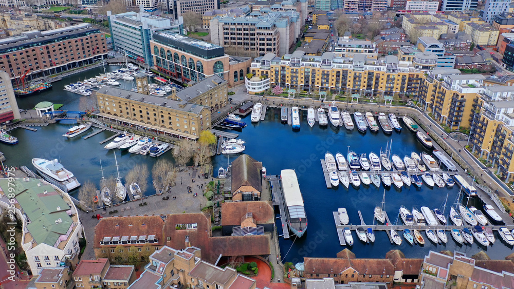 Aerial drone bird's eye view photo of famous St Katharine Docks Marina in City of London near iconic Tower bridge, London, United Kingdom