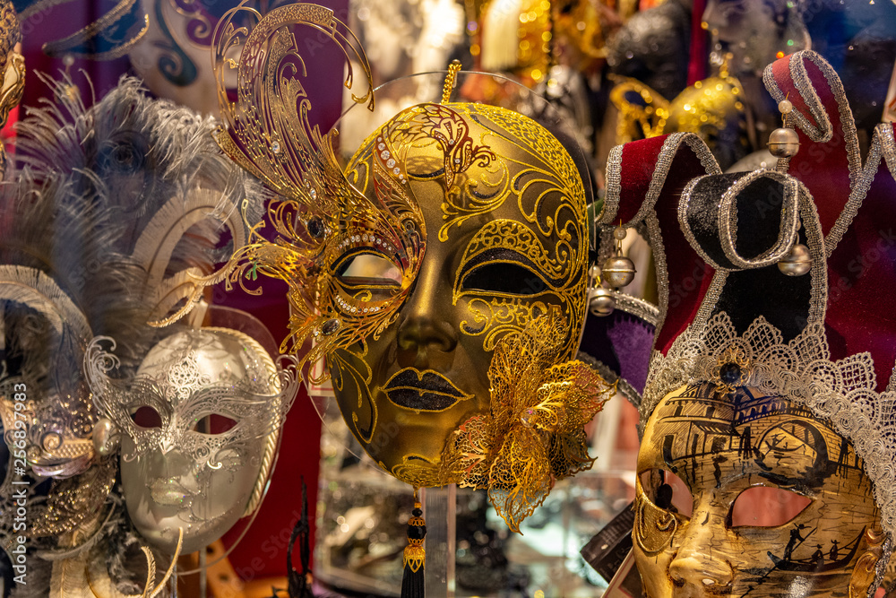 Italy, Venice, carnival 2019, typical Venetian masks and costumes in shop windows and in the street.