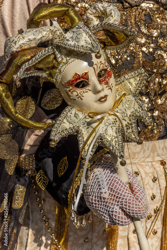 Italy, Venice, 2919 carnival, typical masks, beautiful clothes, posing for photographers and tourists. Details of the dress and objects. © benny