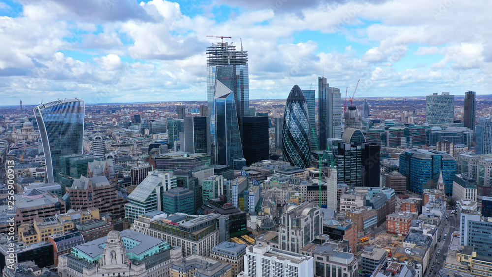 Fototapeta premium Aerial drone panoramic view of iconic financial and bank district with tall skyscrapers in City of London, United Kingdom